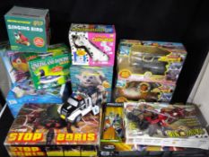 A mixed lot of 12 predominately boxed toys, games and novelty items.