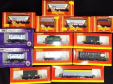 Hornby, Dapol - 13 boxed OO gauge items of Freight rolling stock by Hornby and Dapol.