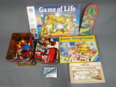 Lego, MB Games and others - Two tins containing a quantity of vintage Lego approximately 3.