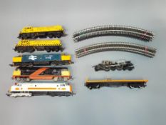 Triang, Lima, Peco - 5 unboxed OO gauge Diesel locomotives, and a quantity of track.