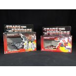 Hasbro Transformers - Two boxed G1 Hasbro Transformers.