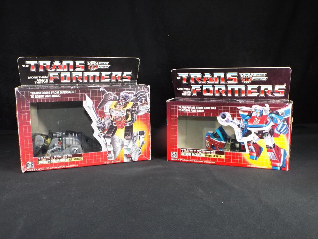 Hasbro Transformers - Two boxed G1 Hasbro Transformers.