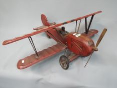 A decorative wooden / composite model of a Bi-Plane.