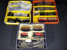 Hornby - Three O gauge clockwork train sets, comprising No 31 Passenger set,