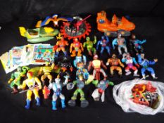 A quantity of predominantly He - Man Masters of the Universe vintage vehicles,