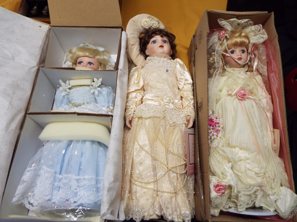 Dolls - an Ashton Drake Galleries dressed doll with stand and original box,