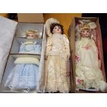 Dolls - an Ashton Drake Galleries dressed doll with stand and original box,