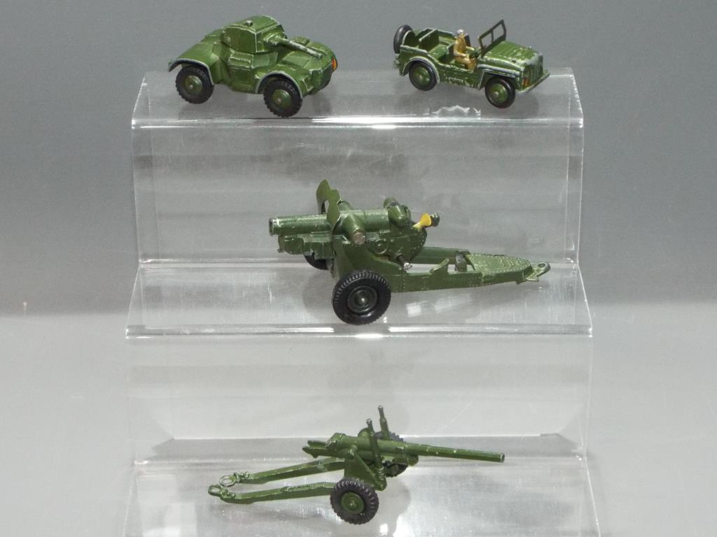 Dinky, Britains - Four unboxed Military vehicles / items.