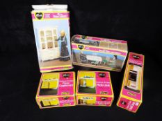 A collection of Sindy by Pedigree doll accessories to include dining table and chairs, hob unit,