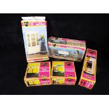 A collection of Sindy by Pedigree doll accessories to include dining table and chairs, hob unit,