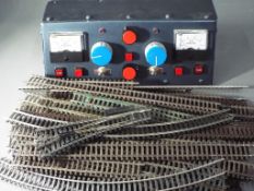 Model Railways - a quantity of Hornby rail tracks with an Altai power supply