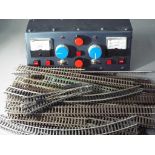 Model Railways - a quantity of Hornby rail tracks with an Altai power supply