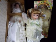 Dolls - three good quality boxed dressed dolls to include one by Ashton Drake Galleries entitled