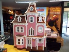 Dolls House - a wooden good quality three storey dolls house containing nine fully furnished rooms