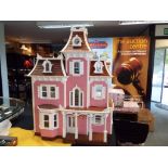 Dolls House - a wooden good quality three storey dolls house containing nine fully furnished rooms