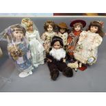 A collection of seven contemporary porcelain faced Collector's dolls, some boxed.