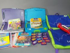 Vtech Smart Book and Elite Pad Learning System in original cases with games,