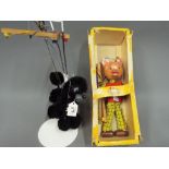 Pelham Puppets - a Pelham Rupert The Bear puppet with box and a Pelham Black Puddle puppet with red