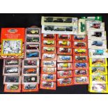 A quantity of boxed diecast model vehicles to include Cameo Village Collection,