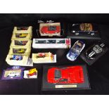 Maisto, Matchbox and others - 14 predominately boxed diecast model vehicles in various scales.
