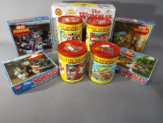 Wombles - a collection of nine Wombles jigsaw puzzles to include four Whitman tin can sets,