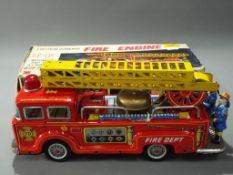 Kokyu - A boxed Vintage Japanes Friction Powered F6 Fire Engine by Kokyu - features pop up 3 way