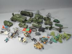 Dinky Britains - a collection of playworn diecast model army vehicles by Dinky and a collection of