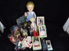 A collection of three mid-century dolls to include a black Marie-Mia doll approximately 5 cm (h),