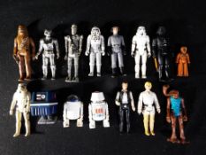 Star Wars - A collection of loose vintage Star Wars action figures to include AT-AT driver, IG-88,