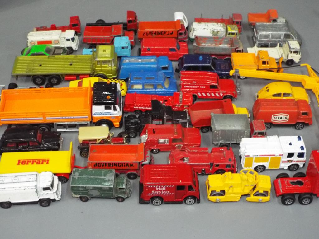 Diecast model vehicles - a mixed lot consisting of a quantity of playworn cars, trucks and vans,