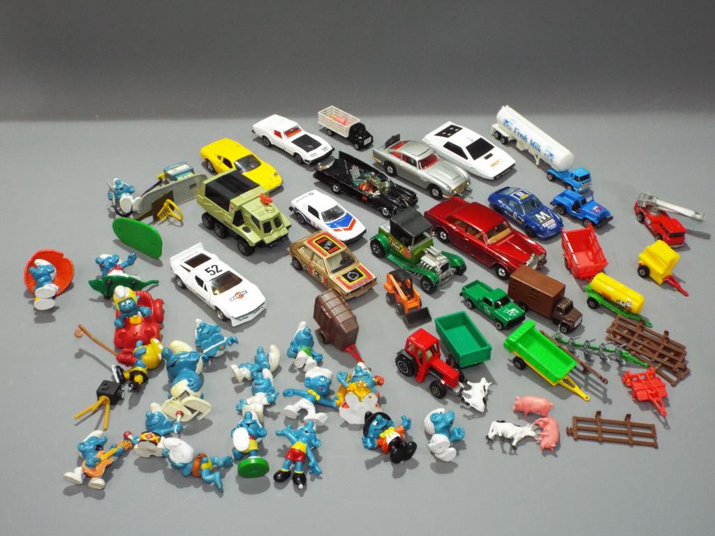A small collection of diecast motor model vehicles to include Corgi, Batmobile, James Bond cars,