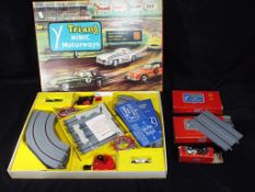 Triang Minic - A boxed Triang Minic M1524 Racing Set and three boxed Minic Motorways accessories.