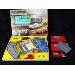 Triang Minic - A boxed Triang Minic M1524 Racing Set and three boxed Minic Motorways accessories.