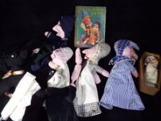 A Punch and Judy hand puppet set with a Punch and Judy hard backed book