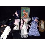 A Punch and Judy hand puppet set with a Punch and Judy hard backed book