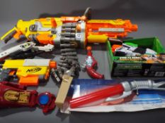 A lot comprising a quantity of Nerf and Banzai power blasters