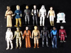 Star Wars - A collection of loose vintage Star Wars figures to include Stormtroopers, Ben Kenobi,