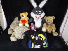 A quantity of soft toys to include a large rabbit, teddy bears and golly,