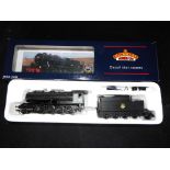 Bachmann - A boxed OO Gauge No.32-253 2-8-0 WD Steam Locomotive and Tender. Op.No.