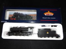 Bachmann - A boxed OO Gauge No.32-253 2-8-0 WD Steam Locomotive and Tender. Op.No.