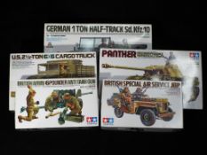 Tamiya - Five boxed 1:35 scale model kits of military vehicles and figures by Tamiya.