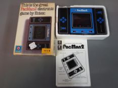 Hand Held Electronic Games - a vintage Entex Taiwan Industries PacMan2 hand held electronic game,