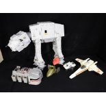 Star Wars - A collection of unboxed vintage Star Wars vehicles to include AT - AT,