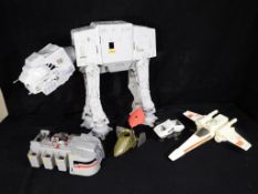 Star Wars - A collection of unboxed vintage Star Wars vehicles to include AT - AT,