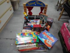 Toys and Games - a good mixed lot of toys and games to include wooden puppet theatre with three