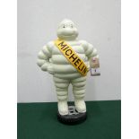 A 15" high cast iron Michelin man standing on tyre