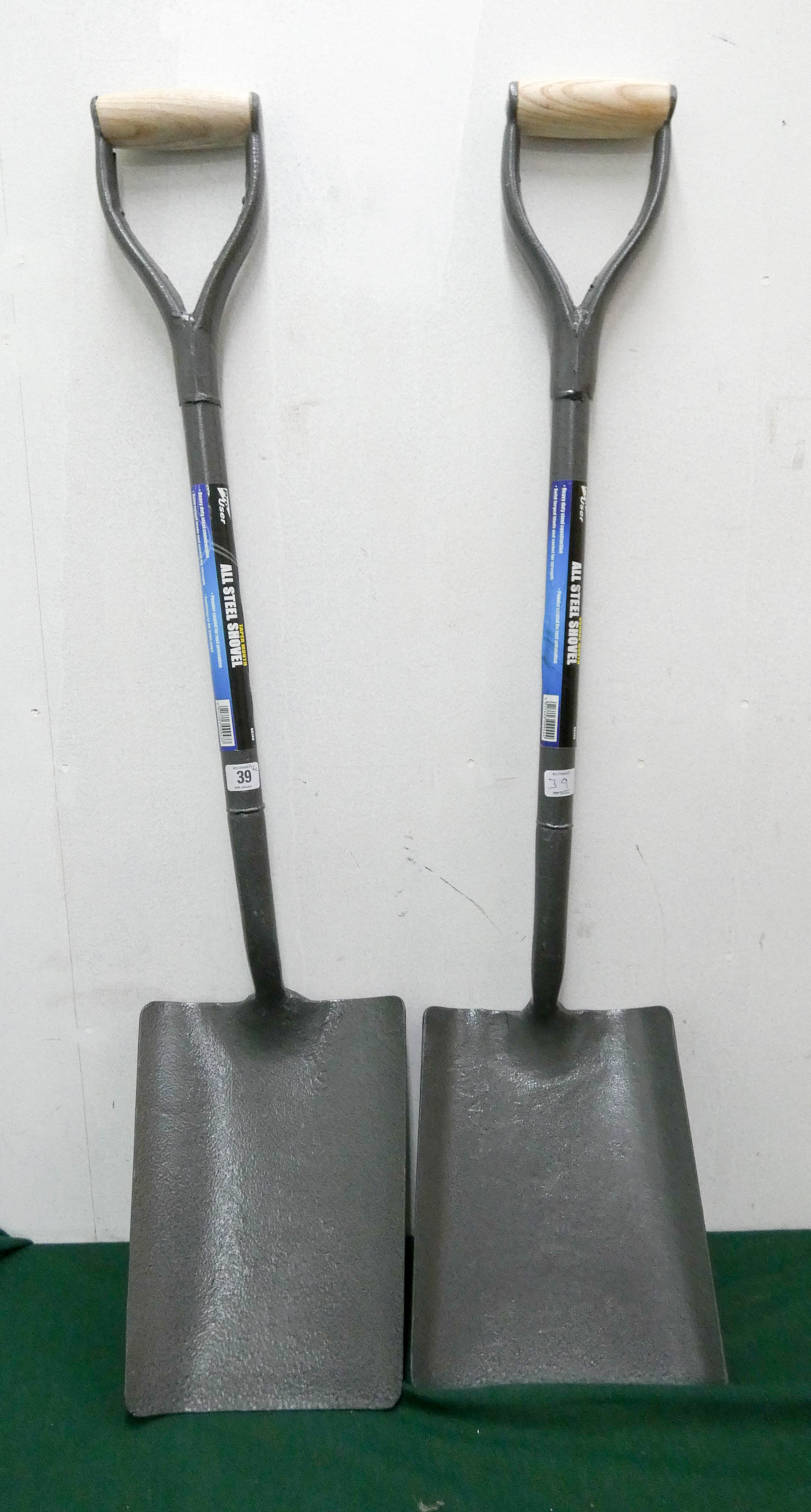 A new all steel tapered mouth shovel and a new all steel square mouth shovel