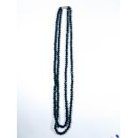 Long double row of faceted jet beads with silver clasp, approx 77 cms long,