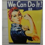 A small painted wall hanging sign 'We Can Do It'