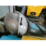 A 110 Volt 9' Bosch angle grinder with spare DeWalt cutting blade